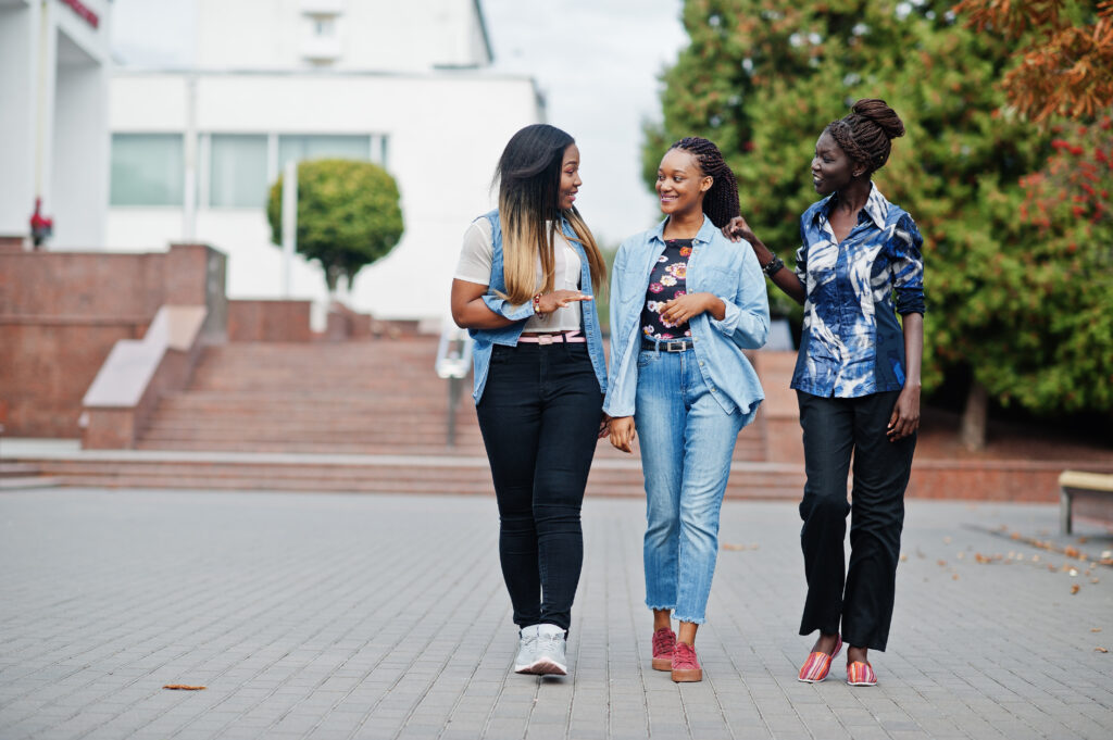 Group of young black female friends hanging out in the city